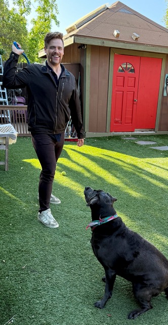 Ryan dog trainer with black dog.